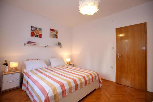 Ένα ή περισσότερα κρεβάτια σε δωμάτιο στο Apartments Ines