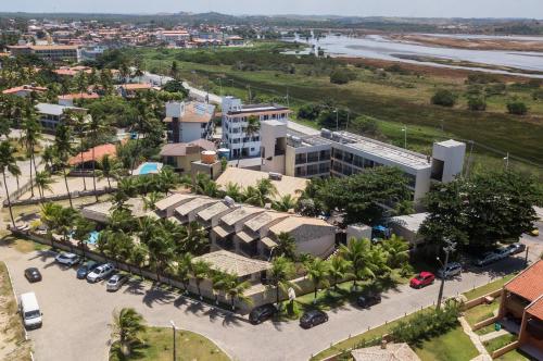 an aerial view of a city with a parking lot at Pousada Recanto do Lobo in Porto De Galinhas