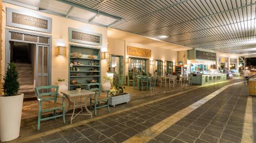 a store with chairs and tables in a building at Livikon by the Sea in Khóra Sfakíon