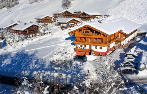 a ski lodge in a snow covered mountain at Aparthotel Hummerau in Alpbach