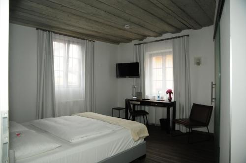 En eller flere senge i et værelse på Hotel Sporcher Nest