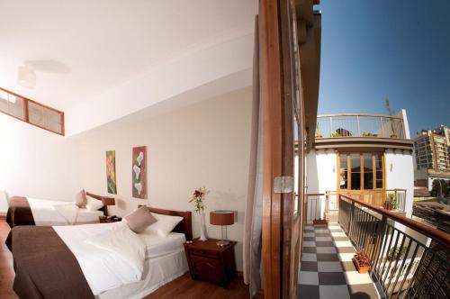 Cama ou camas em um quarto em Hotel Loreto