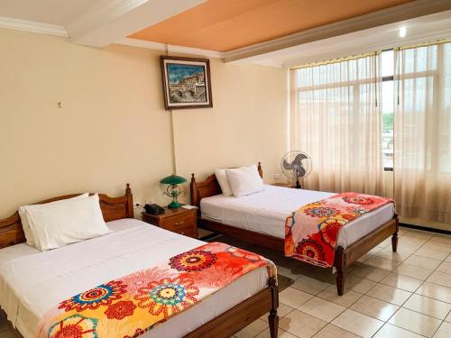 Postel nebo postele na pokoji v ubytování Hotel Somagg