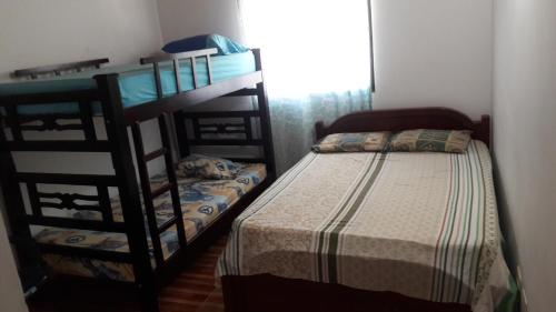 Postel nebo postele na pokoji v ubytování Aparta Hotel Palacios