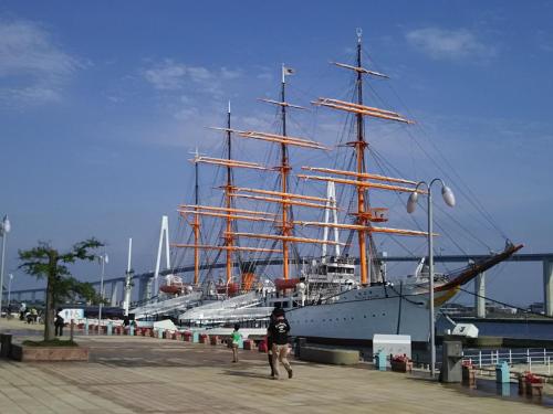 a large ship is docked next to a pier at APA Hotel Uozu Ekimae in Uozu