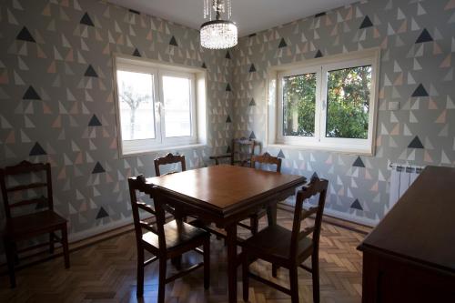 a dining room with a table and chairs at 70s House by Capicua in Braga
