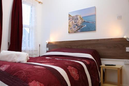 Postel nebo postele na pokoji v ubytování Anand Lodge