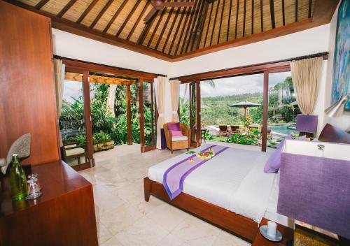 a bedroom with a bed and a large window at Heaven in Bali in Penginyahan