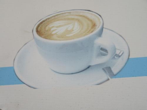a cup of coffee sitting on a plate at STUPA VIEW INN in Kathmandu