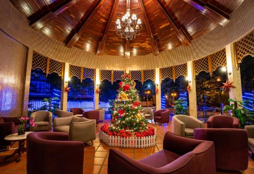 a christmas tree in the lobby of a resort at Century Pines Resort Cameron Highlands in Cameron Highlands