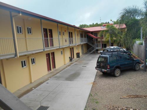 a car parked in a parking lot next to a building at TI Motel Torres Strait in Thursday Island