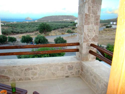 a view from the balcony of a house at Lithos Traditional Guest Houses in Xerokampos