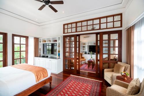 Postel nebo postele na pokoji v ubytování The Colony Hotel Bali