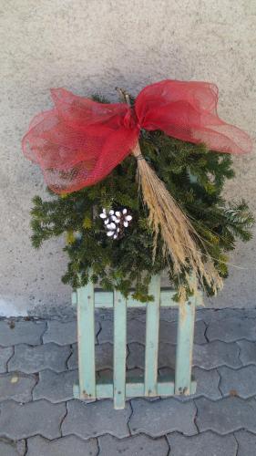 a christmas tree on top of a bird feeder at Baita al Pian in Bormio