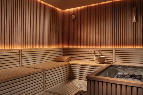 a sauna with a tub in the middle of it at Swissotel The Bosphorus Istanbul in Istanbul