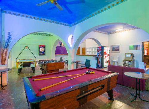 a large swimming pool in a large room at Hostal Alicante in San Antonio
