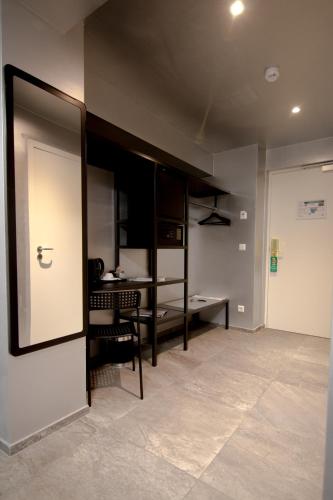 an empty room with a desk and a door at JJ32 in Luxembourg