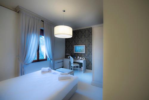 Katil atau katil-katil dalam bilik di Villa Elda Boutique Hotel