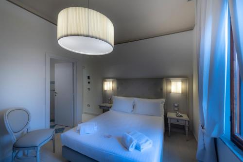 Katil atau katil-katil dalam bilik di Villa Elda Boutique Hotel