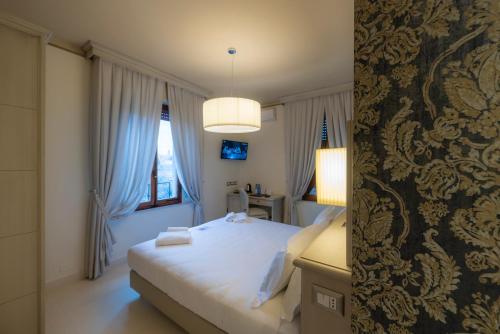Katil atau katil-katil dalam bilik di Villa Elda Boutique Hotel