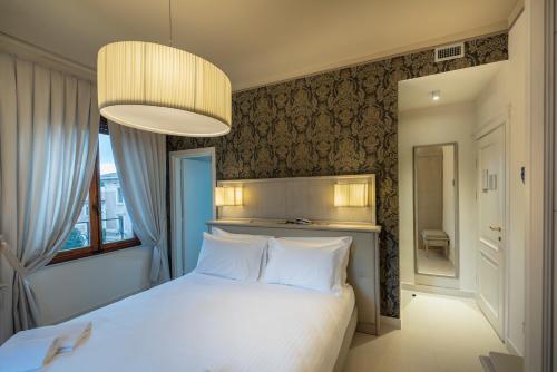 Katil atau katil-katil dalam bilik di Villa Elda Boutique Hotel