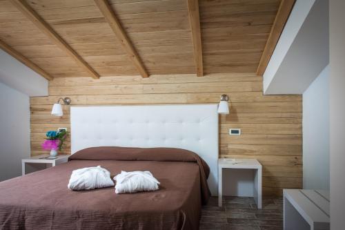 Postel nebo postele na pokoji v ubytování Piccolo Hotel Aurora