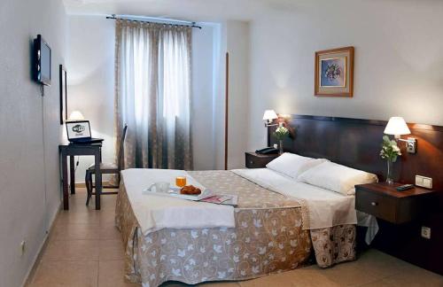 Posteľ alebo postele v izbe v ubytovaní Hotel Praderón