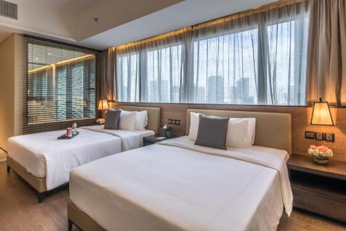 Kama o mga kama sa kuwarto sa I'M Hotel