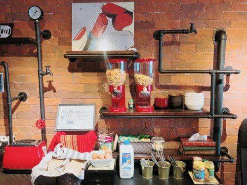 a counter with some food on top of it at hipstercity hostel in Singapore