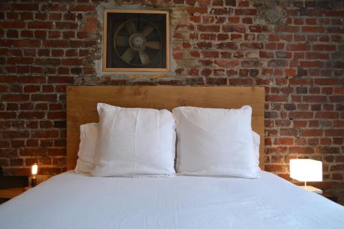 Ένα ή περισσότερα κρεβάτια σε δωμάτιο στο Chambre d'hôtes la Teinturerie