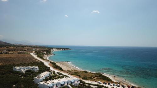 an aerial view of a beach and the ocean at Notos Villas in Frangokastello