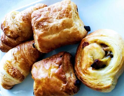 a pile of pastries on a white plate at Gelso Bianco Country Resort in Savignano sul Panaro