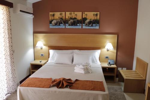 Postel nebo postele na pokoji v ubytování Hotel Belvedere Mindelo, Cabo Verde