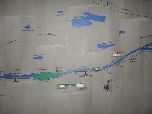 a mural on a wall with a map on it at Kidagil Guesthouse in Thingeyjarsveit
