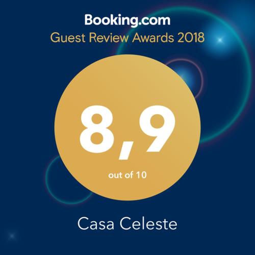 a sign that reads quest review awards with a yellow circle at Casa Celeste in Rome