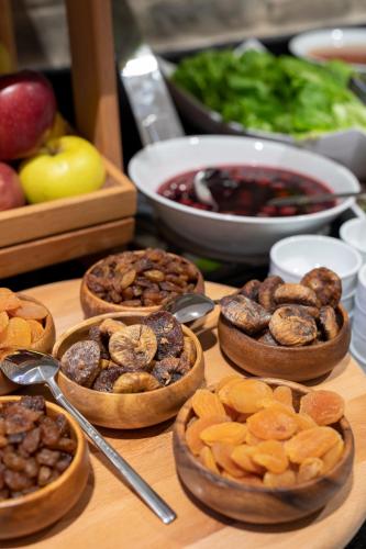 a table topped with bowls of different types of food at Ibis Styles Istanbul Atasehir in Istanbul