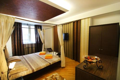 a bedroom with a bed and a large window at Apartments Belgrade in Belgrade