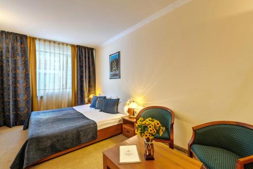 Posteľ alebo postele v izbe v ubytovaní Emerald Apartment-complex