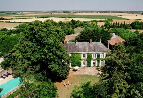 an aerial view of a house with a swimming pool at Château de l'Abbaye - Teritoria in Moreilles