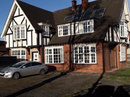 a car parked in front of a house at Tudor Lodge in Scunthorpe