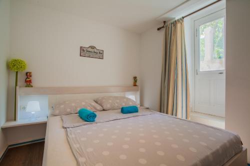 Ein Bett oder Betten in einem Zimmer der Unterkunft Little prince - Your Holiday home on Cres