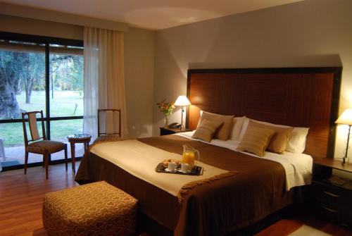 Ένα ή περισσότερα κρεβάτια σε δωμάτιο στο Suter Petit Hotel