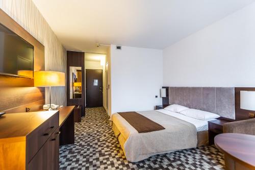 Postel nebo postele na pokoji v ubytování Hotel Solny