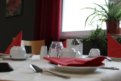 a table with a red napkin on top of it at Heppenheimer Hof Hotel in Worms