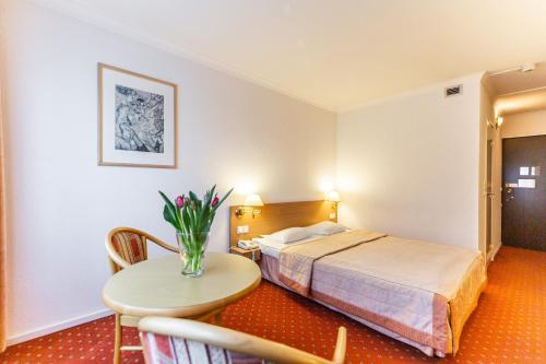 Postel nebo postele na pokoji v ubytování Hotel Solny