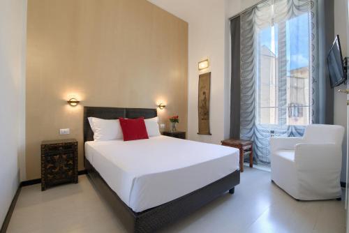 A bed or beds in a room at Alloggio per uso turistico D'Ambrosio Antonella Gli Scipioni 53