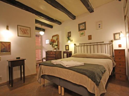 a bedroom with a large bed in a room at Terrace Apartment - Heart of Trastevere in Rome