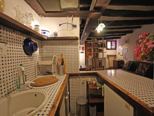 a bathroom with a sink and a bath tub at Terrace Apartment - Heart of Trastevere in Rome