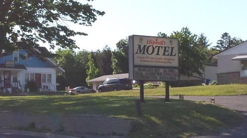 a sign for a motel in front of a house at Hipwell's Motel in Fonthill