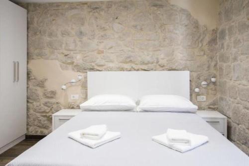 Posteľ alebo postele v izbe v ubytovaní Elegant Residence Rooms